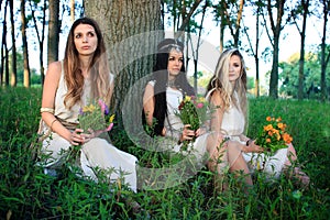 Morning photo session in the forest with three pagan women