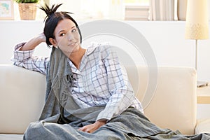 Morning portrait of pyjama girl with blanket