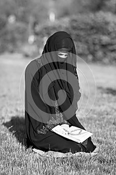 Morning prayer of an eastern woman on the street.