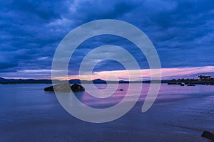 Morning rock in water at sunrise