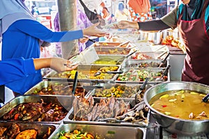 Halal home-cooked dishes stall in daily market photo