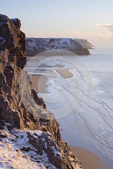 Morning sun lights sheer cliffs