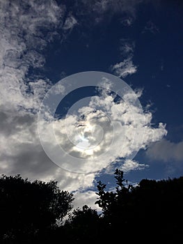 Morning sun rays shining through the clouds