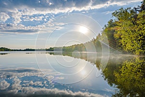 The morning sun and reflection in the lake