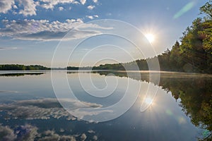 The morning sun and reflection in the lake