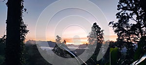 the morning sun shines on the earth and mountain