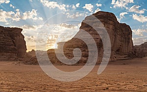 Morning sun shines over rocky desert formations, typical landscape in Al Ula, Saudi Arabia