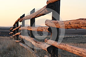 Morning sun shining on a ranch fence in Wyoming. photo