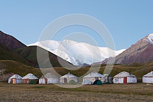 Morning Sunlight Landscape of Lenin Peak 7134m at Tourist Yurt camp of Tulpar Kol Lake in Alay Valley, Osh, Kyrgyzstan.