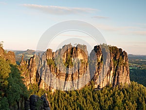 Morning sunlight on rocky towers of Schrammsteine in national park Saxony Switzerland, Germany