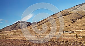 Morning sunrise Andes mountains landscape in Patagonia Argentina, South America. Rustic gaucho farm. Autumn landscape photo