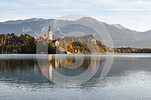 Morning sunrise beautiful lascape of Lake Bled with Alps at background and blue water