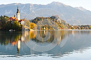 Morning sunrise beautiful lascape of Lake Bled with Alps at background and blue water