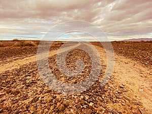 morning sunrise desert mountain adventure trail dirt road lonely empty silhouette dusk horizon landscape scene