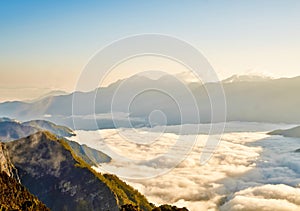 Morning sunrise, dramatic cloud of sea, giant rocks and Yushan mounatin under bright blue sky in AlishanAli mountain National Pa