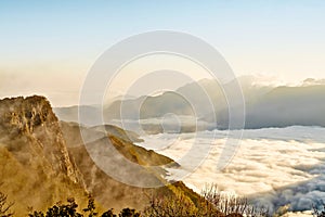 Morning sunrise, dramatic cloud of sea, giant rocks and Yushan mounatin under bright blue sky in AlishanAli mountain National Pa