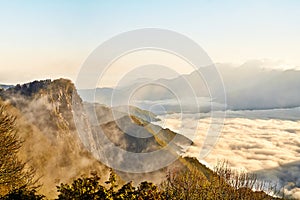 Morning sunrise, dramatic cloud of sea, giant rocks and Yushan mounatin under bright blue sky in AlishanAli mountain National Pa