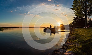 Morning Sunrise Fishing trip on a Boat at the Cottage Dock in Ontario Canada