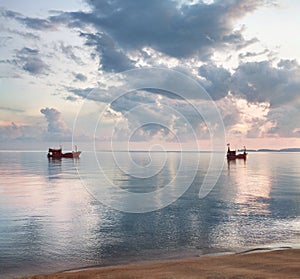 Morning sunrise light pink sky, blue sea, white clouds, two ships silhouette, sunset on ocean coast, beautiful seascape, Thailand