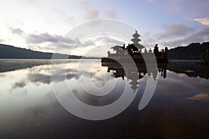 Morning sunrise over the Beratan Lake with Ulun Danu temple and its water reflection, Bali, Indonesia