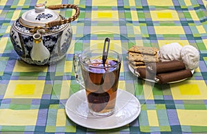 Morning tea glass tea cup, tea and sweets