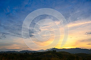 Morning time of panorama mountain under dramatic twilight sky and cloud. Nightfall Silhouette mountain on sunset