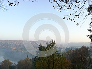 Morning view on hills with forest in autumn day in Latvia