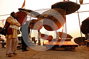 Morning view of holy ghats of Varanasi. Umbrellas and beds on ghat