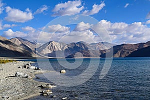 Morning view of Pangong lake with himalyan mountain range in background in Leh