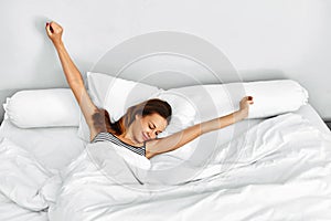 Morning Wake Up. Woman Waking Stretching In Bed. Healthy Lifestyle