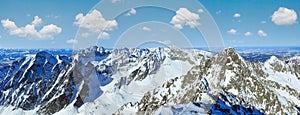 Morning winter rocky mountain top view. Lomnicky Peak, Vysoke Tatry. Panorama