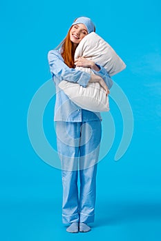 Morning, woman and beauty concept. Full-length vertical shot cheerful, tender, lovely redhead teenage girl in nightwear