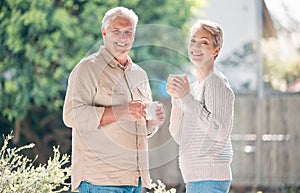 Mornings made in retirement heaven. Shot of a happy senior couple enjoying a relaxing coffee break in the garden at home