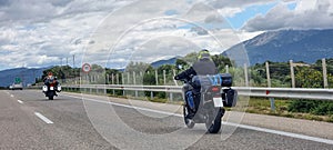 morobike motorbike travelling speeding on asphalt road in cloudy day