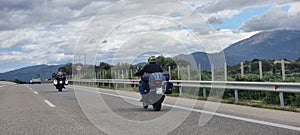 morobike motorbike travelling speeding on asphalt road in cloudy day