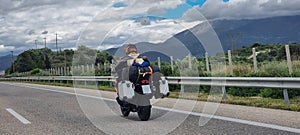 morobike motorbike travelling speeding on asphalt road in cloudy day