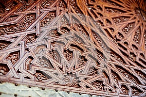 Moroccan architecture details an intricately carved wooden door