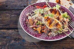 Moroccan barbecue chicken skewer dish with quinoa