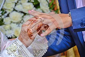 A Moroccan bride wears her groom`s wedding ring.
