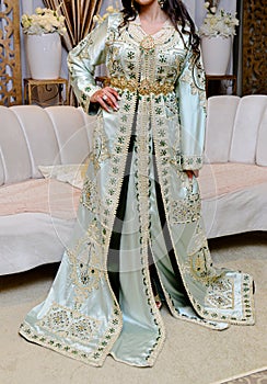 Moroccan caftan, Moroccan Dress . Traditional Moroccan dress worn by women at weddings. One of the most famous clothes in the photo