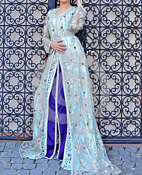 The Moroccan caftan is a Moroccan women`s traditional costume. It is considered one of the oldest traditional clothes in the worl photo