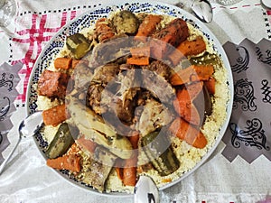 Moroccan couscous dish prepared as is customary on Fridays.  this dish contains vegetables and meat