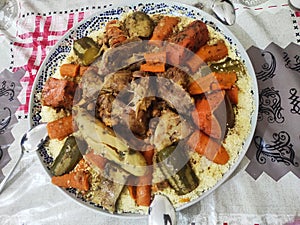 Moroccan couscous dish prepared as is customary on Fridays.  this dish contains vegetables and meat photo
