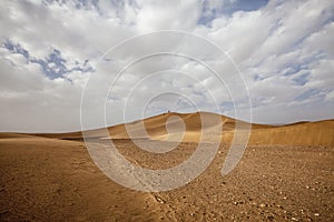 Moroccan desert landscape with blue sky. Dunes background