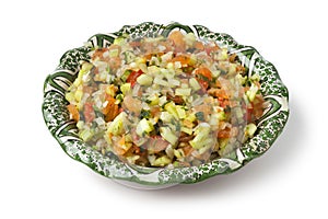 Moroccan dish with mixed vegetable salad and herbs