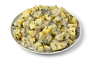 Moroccan dish with potato salad and herbs