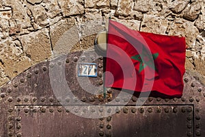 A Moroccan flag flies over a doorway of the former fortress in Essaouira in Morocco.