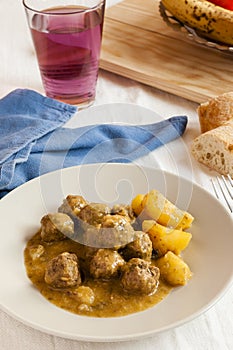 Moroccan kefta tajine meatballs on served on a table.