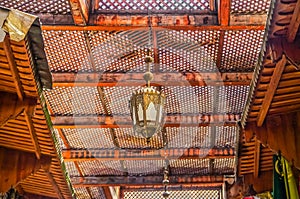 Moroccan lantern and cedar wood carved ceiling