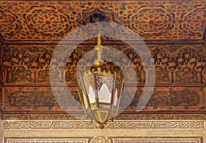 Moroccan lantern and cedar wood carved ceiling